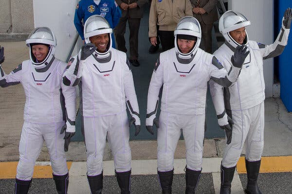 From left, Shannon Walker, Victor Glover, Mike Hopkins and Soichi Noguchi, the four astronauts who launched toward the space station on Sunday.